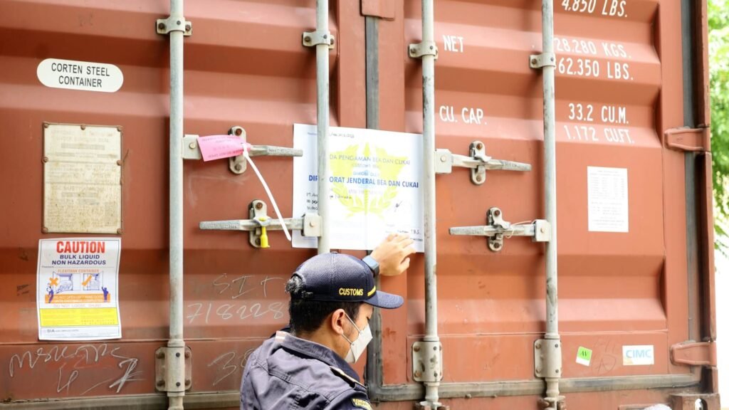  A cargo manager confidently pointing to the correct seal for a specific shipment, based on a checklist