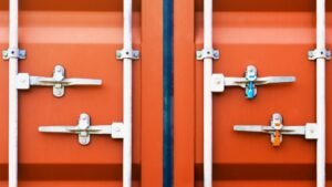 Container door locked with protective lead seal. Security of cargo shipment. truck transport, logistics freight truck.