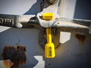 Bolt seal correctly applied to a shipping container latch