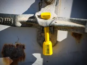 Bolt seal correctly applied to a shipping container latch