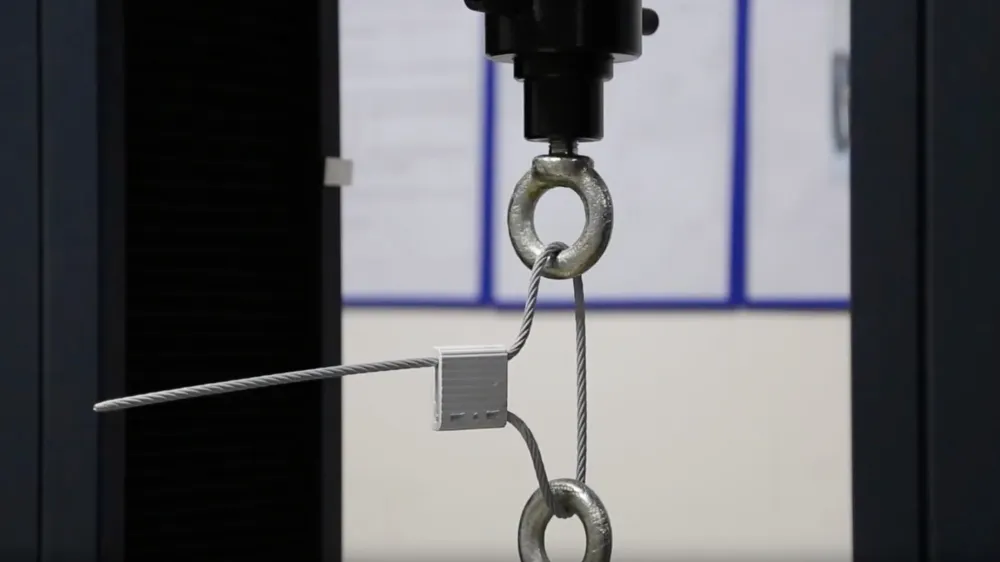 ISO 17712 Physical Performance Tests A laboratory setting showing machines designed for tensile, shear, and impact testing of security seals.