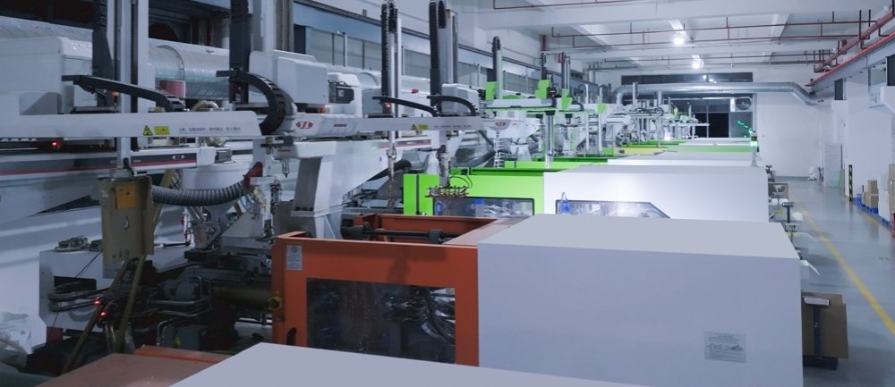 An image of a busy, clean factory floor with multiple production lines for security seals in operation.