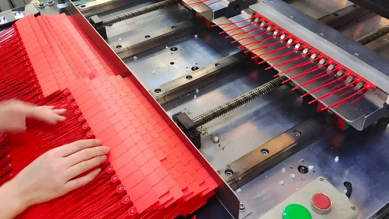 alt: A factory production line manufacturing security seals