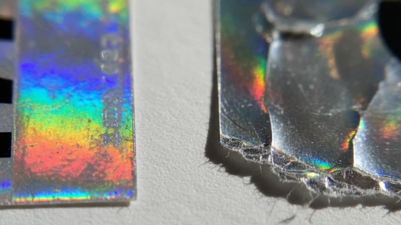 Precise Die-Cut Edge vs. Rough Edge A close-up comparison of two hologram label edges: one is perfectly smooth and die-cut, the other is jagged and rough.