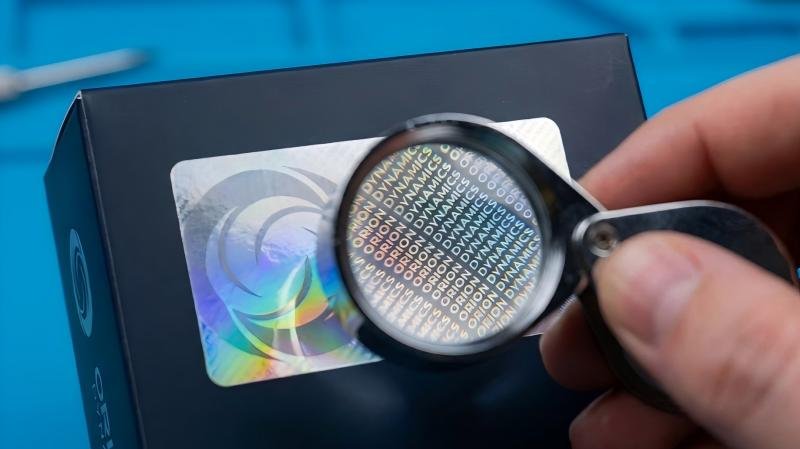 A custom hologram that reveals a company's micro-text logo under magnification.
