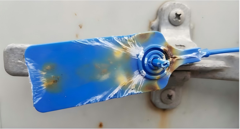 Plastic seal showing white stress marks and discoloration from heat application